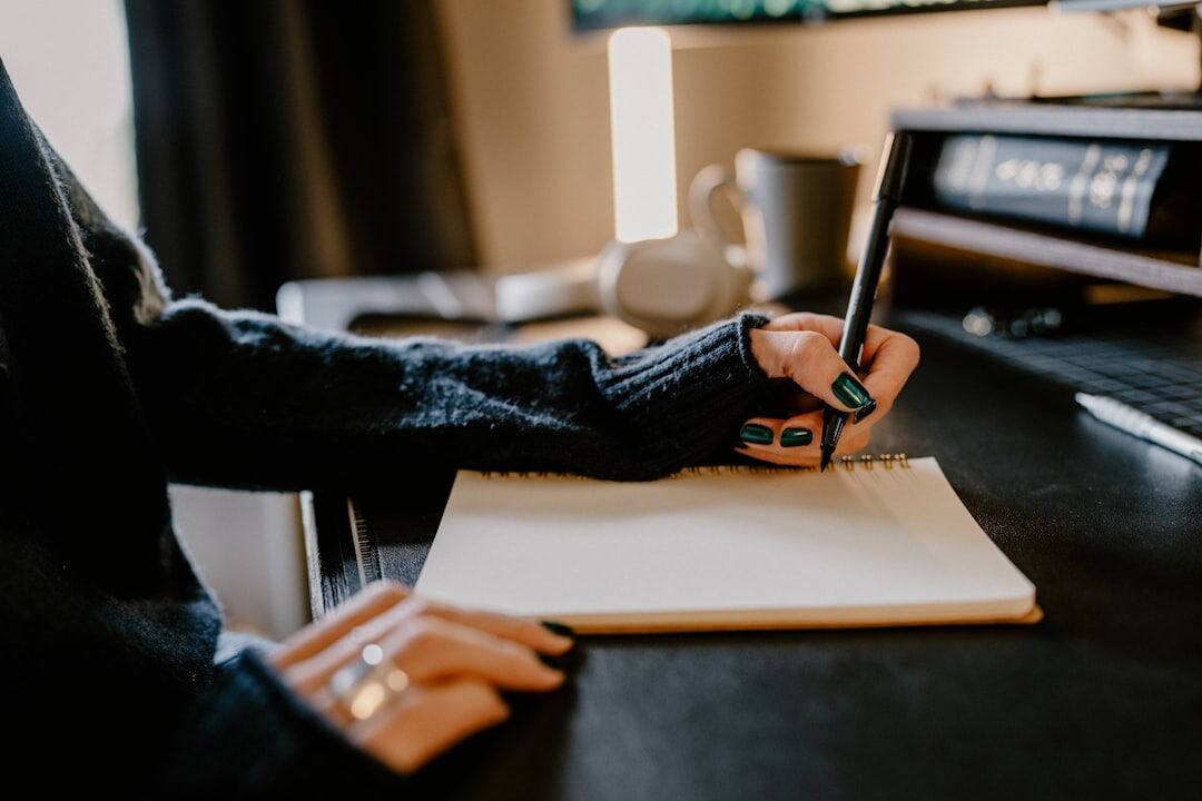 mystery writer at desk with notebook