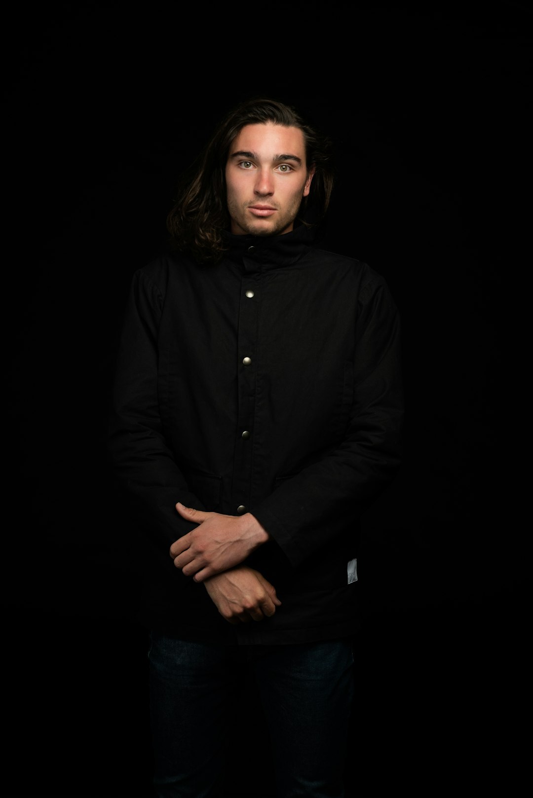 Studio portrait of a serious middle-aged man in a dark jacket
